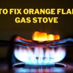 how to fix orange flame on gas stove